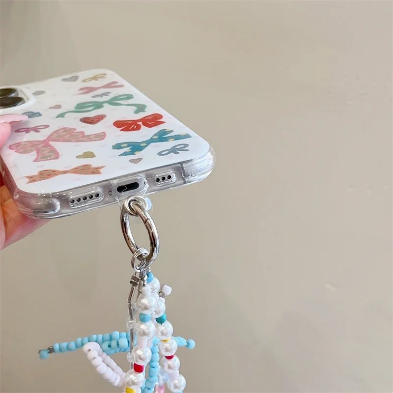 Custodia per telefono Bowknot di colore coreano di moda per iPhone 17 Pro 16 15 14 Pro Max Cover posteriore con cinturino a catena Simpatico cartone animato protettivo C