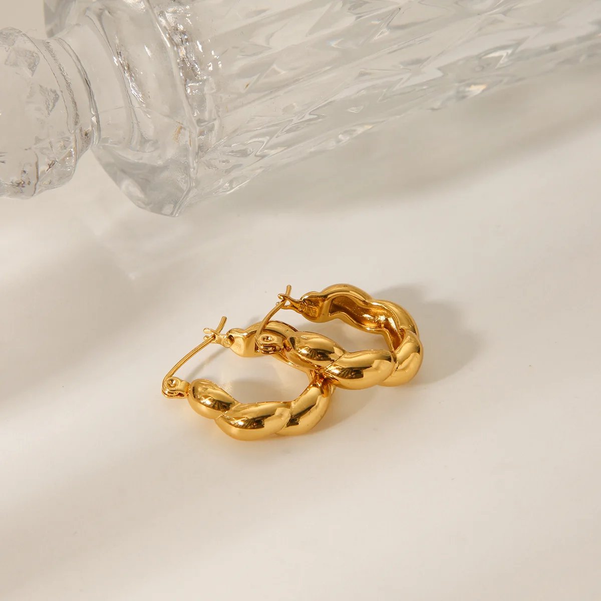Stainless steel threaded twist earrings for women, light luxury versatile titanium steel ear jewelry with a premium look