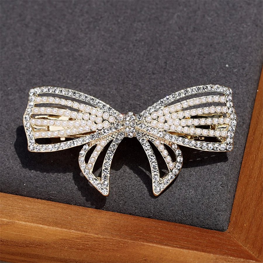 

Elegant temperament crystal bow hair clip women's fashion personality alloy pearl spring clip Korean small jewelry wholesale