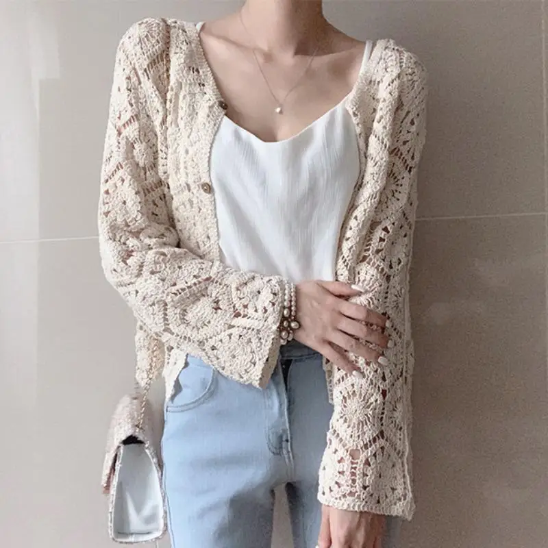 A niche sweet and stylish loose fitting, slimming versatile knitted top with lace hook flower hollow small cardigan for women