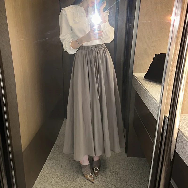 

Women's pleated skirt with a large hem2026New Summer High-Waisted DrawstringaSlimming midi skirt with a stylish design