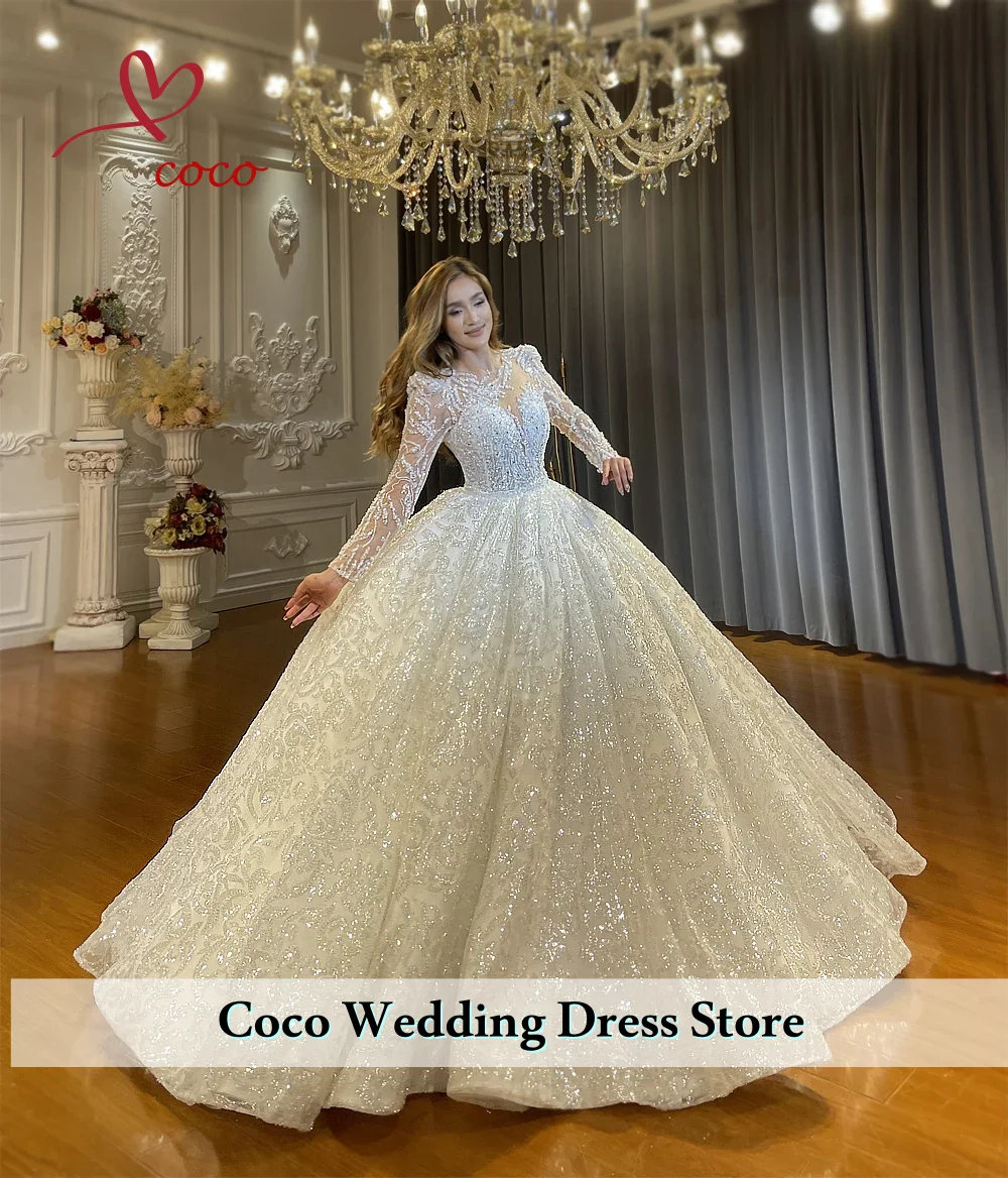 فساتين زفاف الأميرة الرائعة المطرزة باللؤلؤ بأكمام طويلة من الدانتيل اللامع فساتين زفاف فيستدوس دي نوفيا
