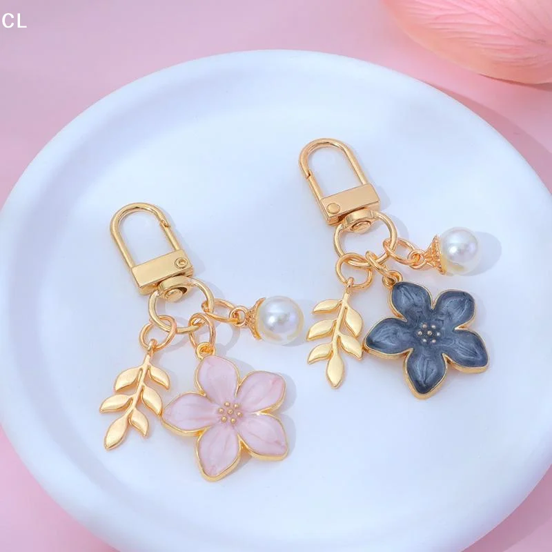 AttireTroveRomantic Flower Keychain Lucky Five Leaves 3D Hollow Flower Ball Key Rings For Girls Earphone Case Decor
