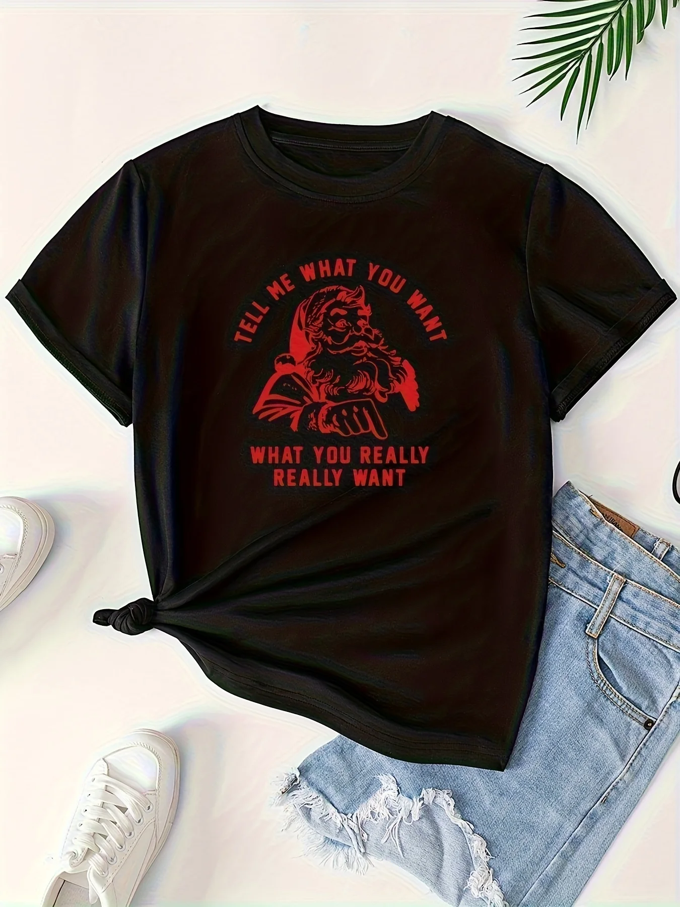 تي شيرت نسائي كاجوال فضفاض مناسب لعيد الميلاد سانتا كلوز مع طباعة نصية "أخبرني ما تريده حقًا".