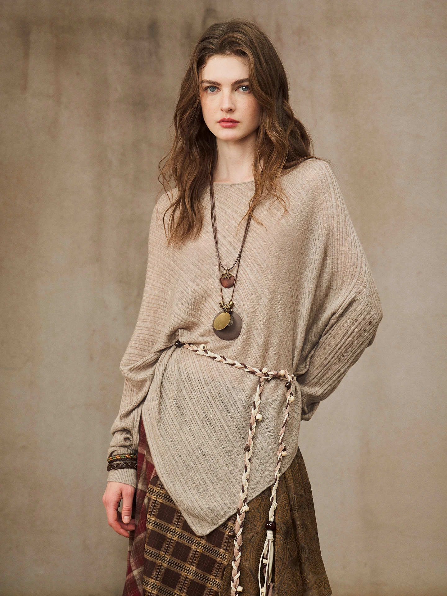 

Ele Knitted Long Sve Asymmetrical Hemline Sweater in Sand Dye by Miorastudio Comfortable Loose Fit round Ne Design