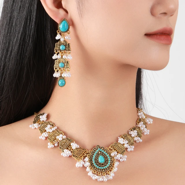 Aretes colgantes geométricos en piedra azul y oro para mujer