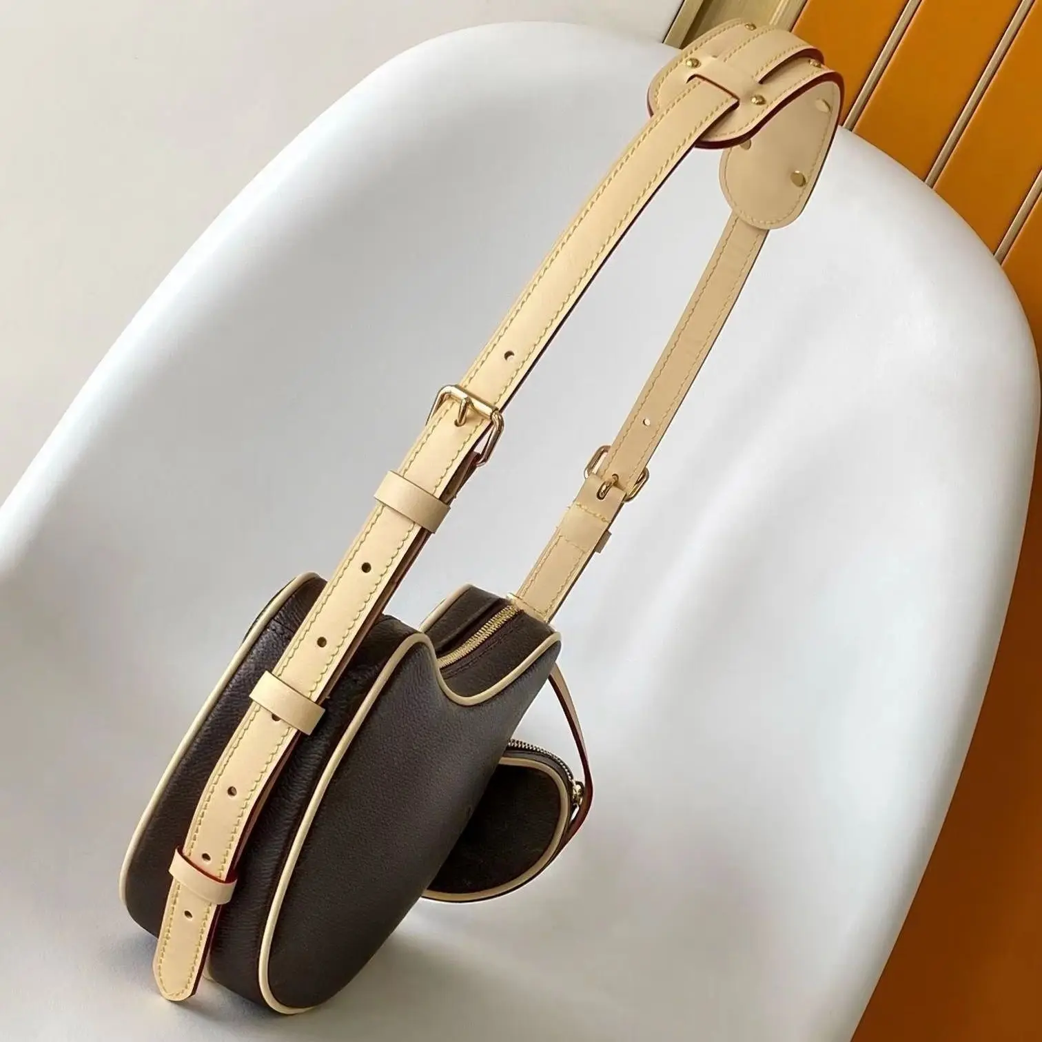

Vintage-inspired hobo handbag, with pebbled leather, adjustable strap, and coordinating mini pouch.