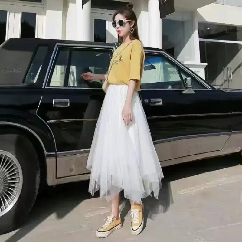 تنورة متوسطة الطول شفافة على شكل حرف A عالية الخصر - تنورة نسائية مكشكشة شبكية ذات طبقات غير متناظرة باللون الأسود