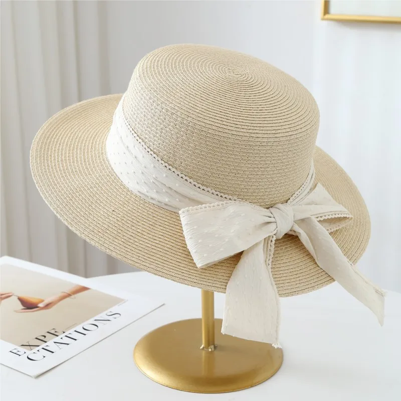 A lady in hat wide-brimmed and shade that can be folded for vacation