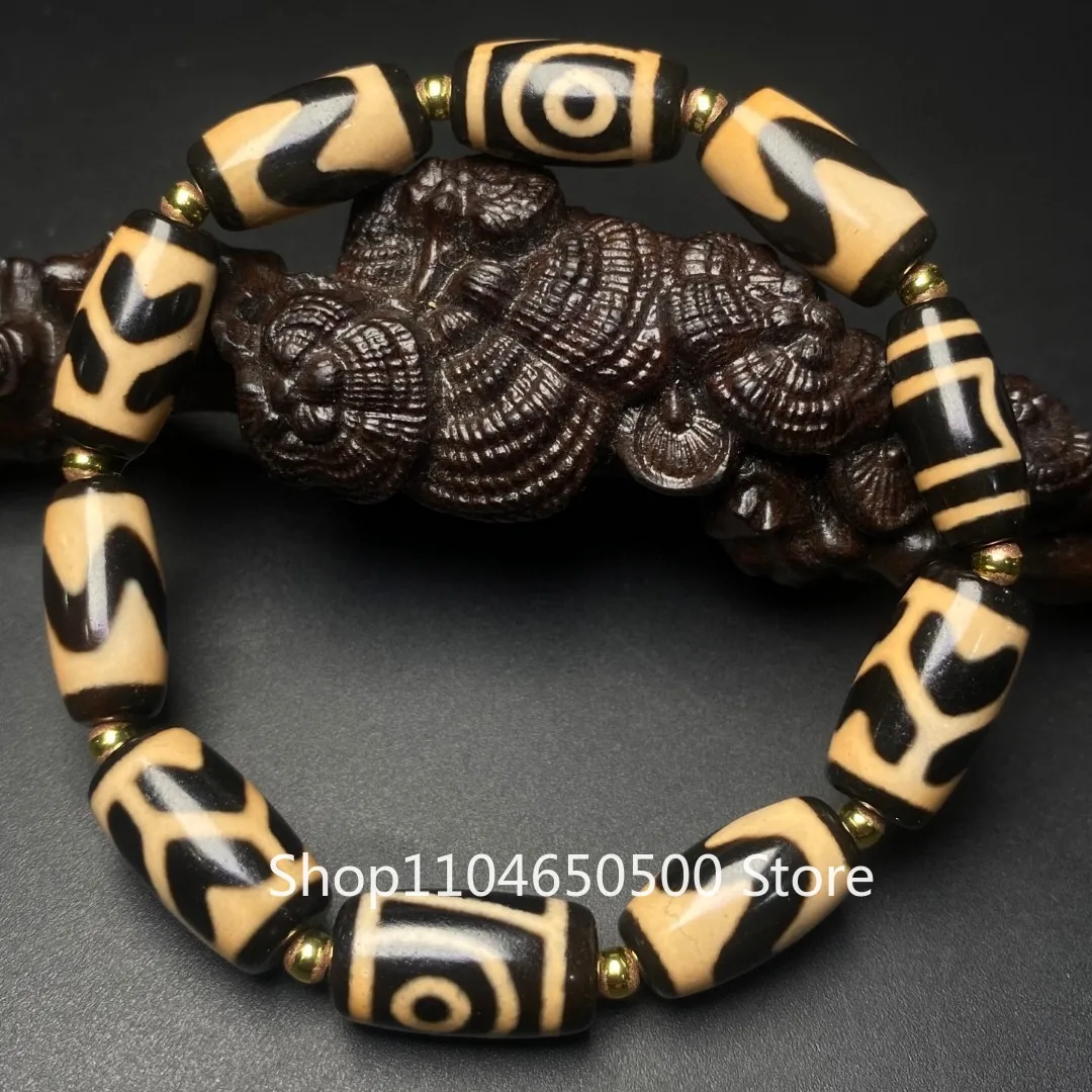 

Ya Huang Tiandi Два глаза Тигровый зуб Флуоресцентный желтый Бог богатства Dzi Bead Barrel Агатовый браслет Duobao Браслет из бисера Separa