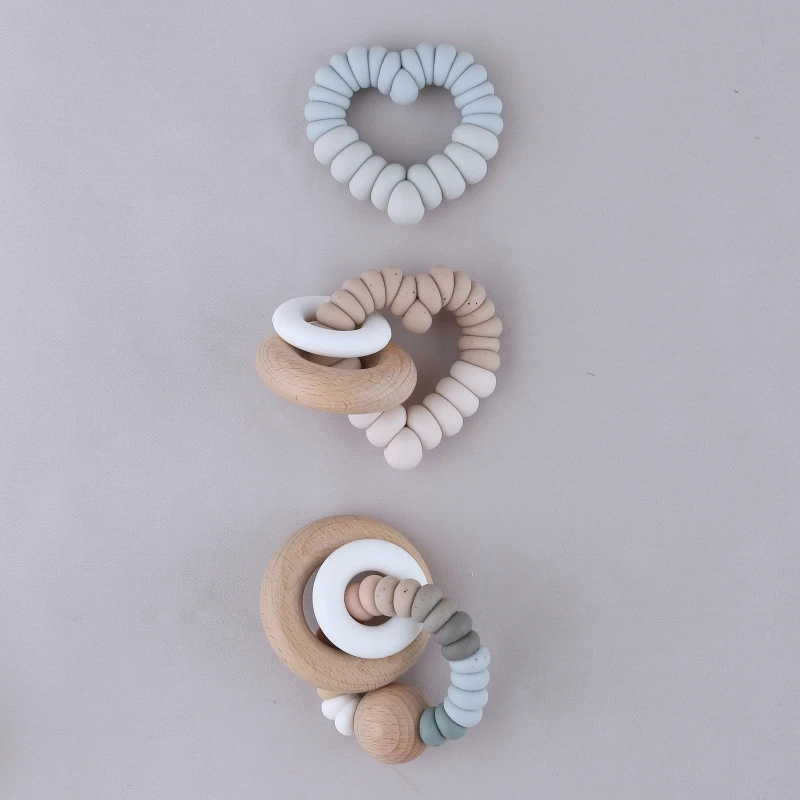 1pc BPA Free Silicone Baby Teether Heart Shape Baby Wooden Ring Bracelets Silicone Beads Newborn Rodent Molar Teething Rattle