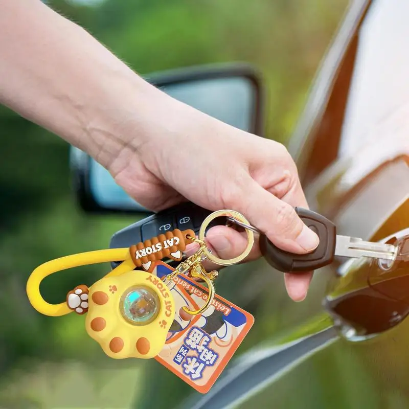 Llaveros de dibujos animados de PVC para mochilas, colgante de pata portátil y creativo con luz de puesta de sol para mochila, estuche de lápices móvil