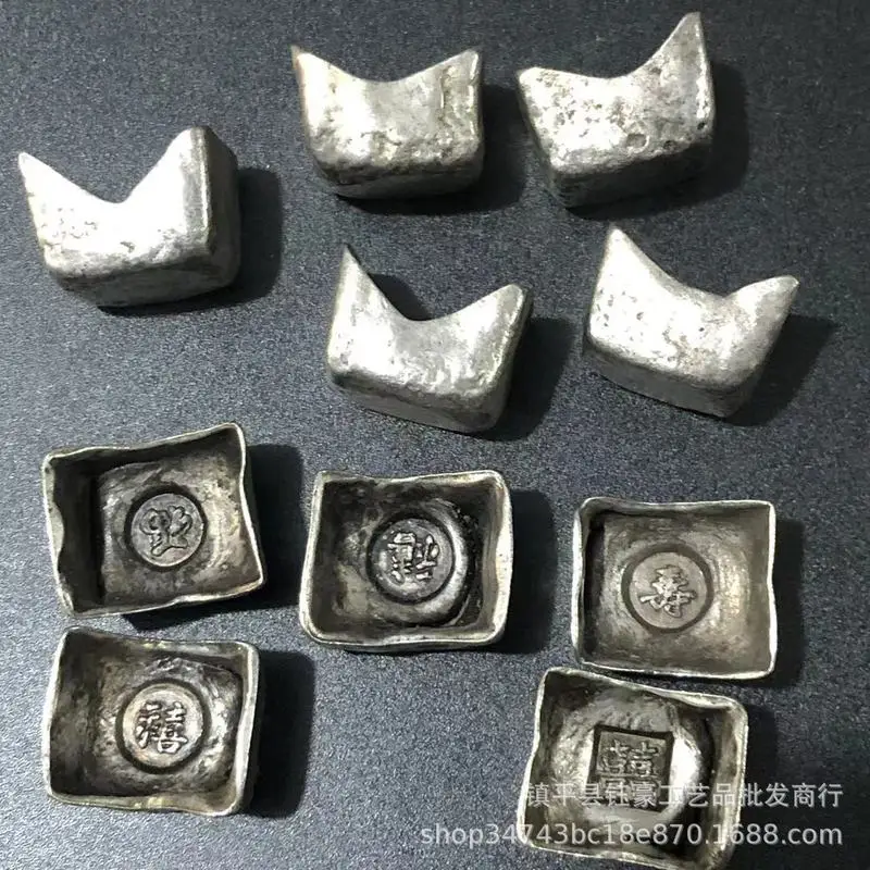 Antique and miscellaneous items, including old silver-plated white copper ingots depicting the symbols of fortune, longevity, ha