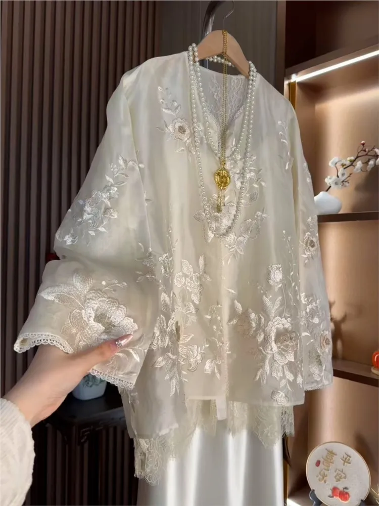 A light luxury cardigan with elegant and refined style featuring European-style lace patchwork heavy embroidery