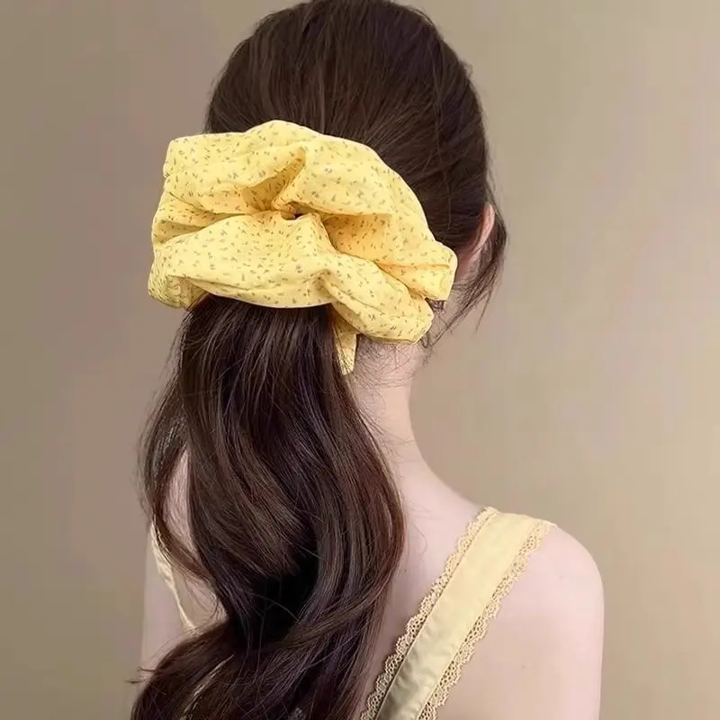 

1pc Soft yellow chiffon floral-pattern hair tie with braided texture, headband, and bun-style hair accessory