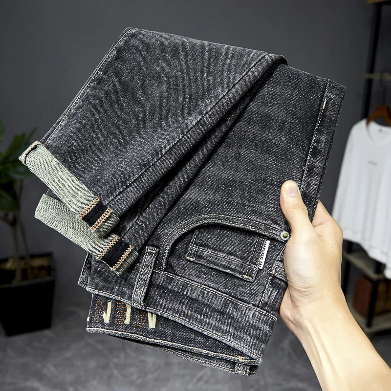 Jeans slim estilo chinês masculino, tendência de rua, calças simples high-end, moda que combina com tudo, quatro estações