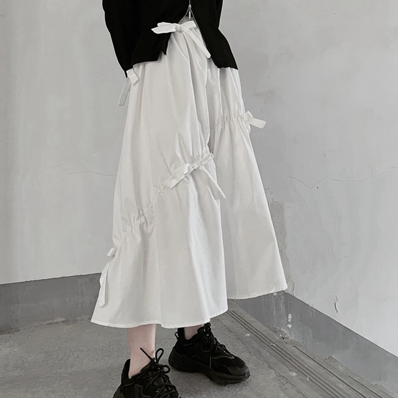 

Белая юбка-миди А-силуэта 2024 года, летняя новинка в корейском стиле, с завышенной талией, стройнящая, универсальная, однотонная, с узлом, средней длины