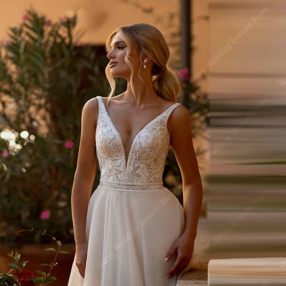 魅力的な A ラインのウェディングドレスセクシーなディープ V ネックレースフラワープリントノースリーブプリンセスブライダルドレス背中の開いた Vestido カスタマイズ