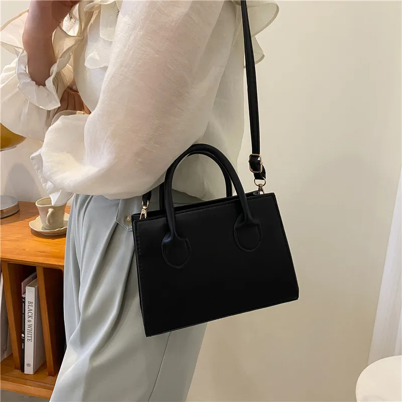 Vielseitige schwarze kleine quadratische Tasche, modische Version, einfache Tragetasche, Damen-Tasche für den täglichen Gebrauch, einzelne Handy-Handtaschen, Schulter-Cross-Taschen