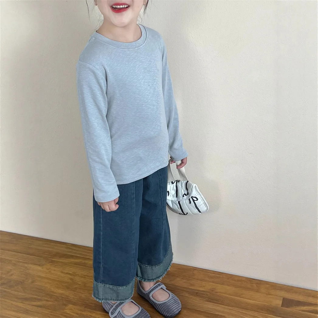 أطفال الخريف الربيع أسفل قميص 2025 جديد الكورية المألوف الفتيات الفتيان بلون طويل الأكمام بسيطة عادية اليومية تي شيرت