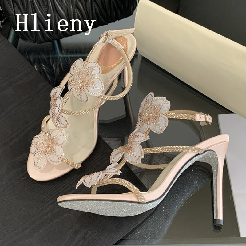 

Hlieny/пикантные женские босоножки на тонком высоком каблуке с узкими ремешками и кристаллами, летние женские свадебные туфли в уличном стиле с открытым носком и пряжкой на ремешке