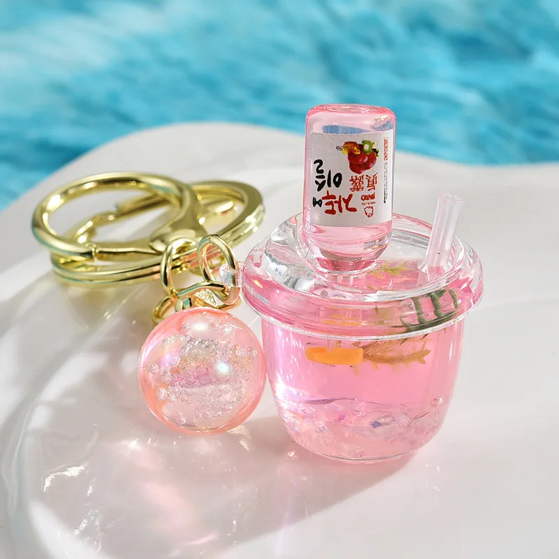 Yaratıcı aydınlık Soda su Quicksand anahtarlık sevimli soğutulmuş şarap şişesi yüzer sıvı anahtarlık Mini gece lambası süs Keyfob