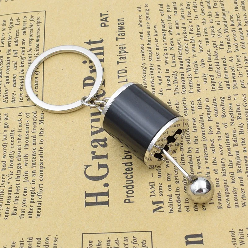 A Mini Gear Shift Keychain Modeled After Car Parts, Featuring a Cool Design for Automotive Enthusiasts to Carry Daily