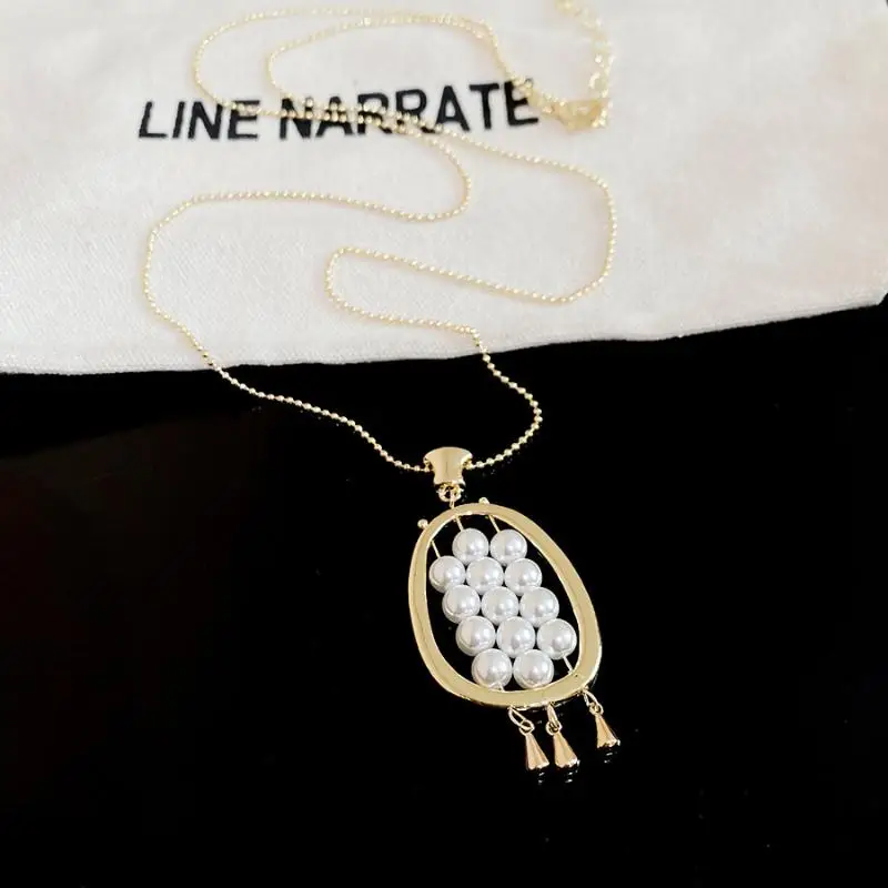 Pearl Bead Long Necklace with Tassel and Oval Pendant Ideal for Fashion Aficionados and Special Occasions