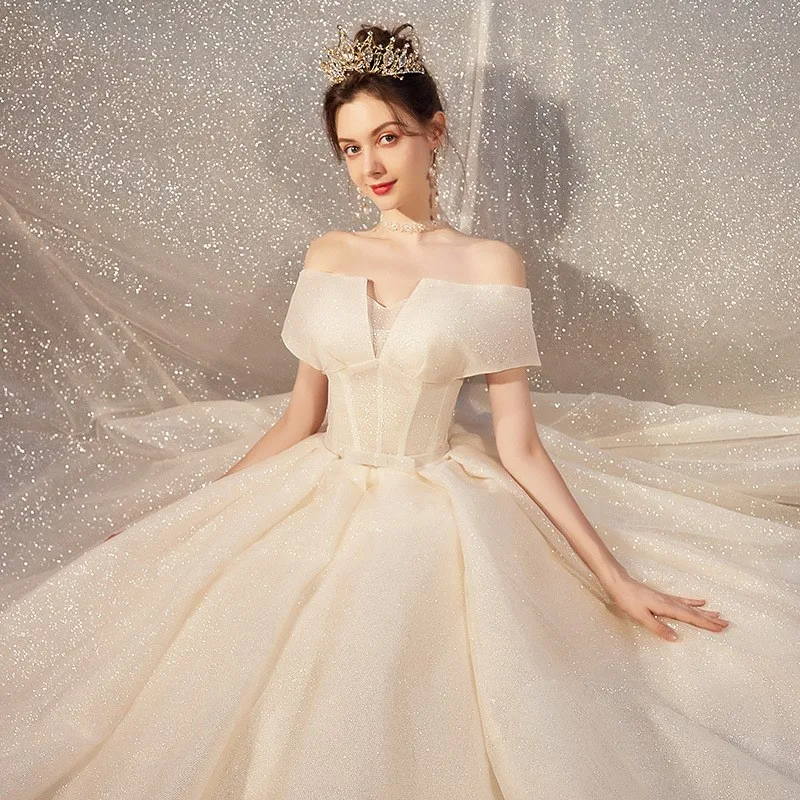 

A new one-shoulder light and ethereal dreamy dress with tail