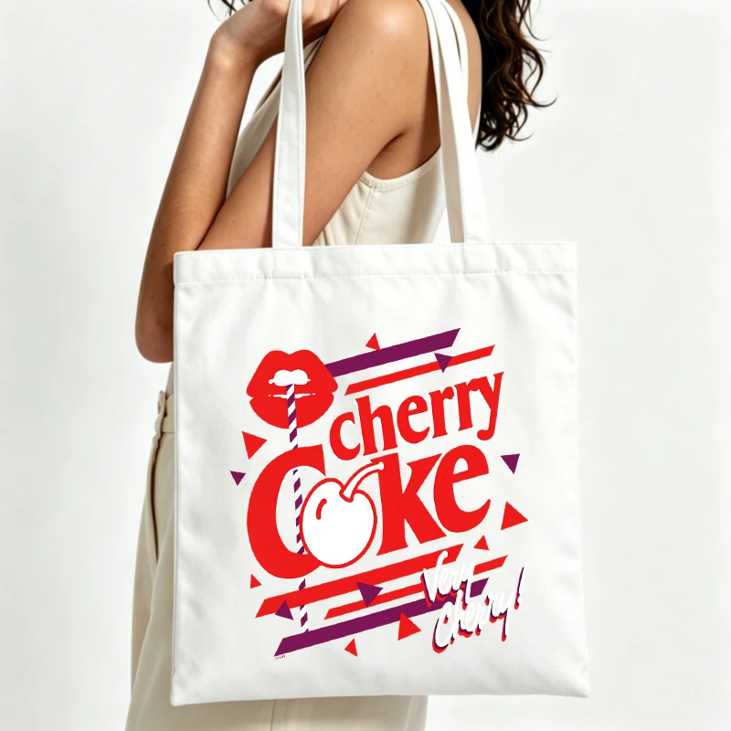 Women's lip and cherry graphic canvas tote bag with retro typography print, ideal for casual daily use and summer outings