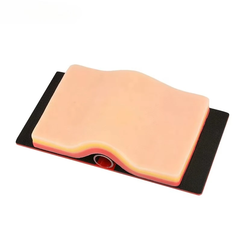 Wound suturing practice pad with hook and loop tissue tension device for practice