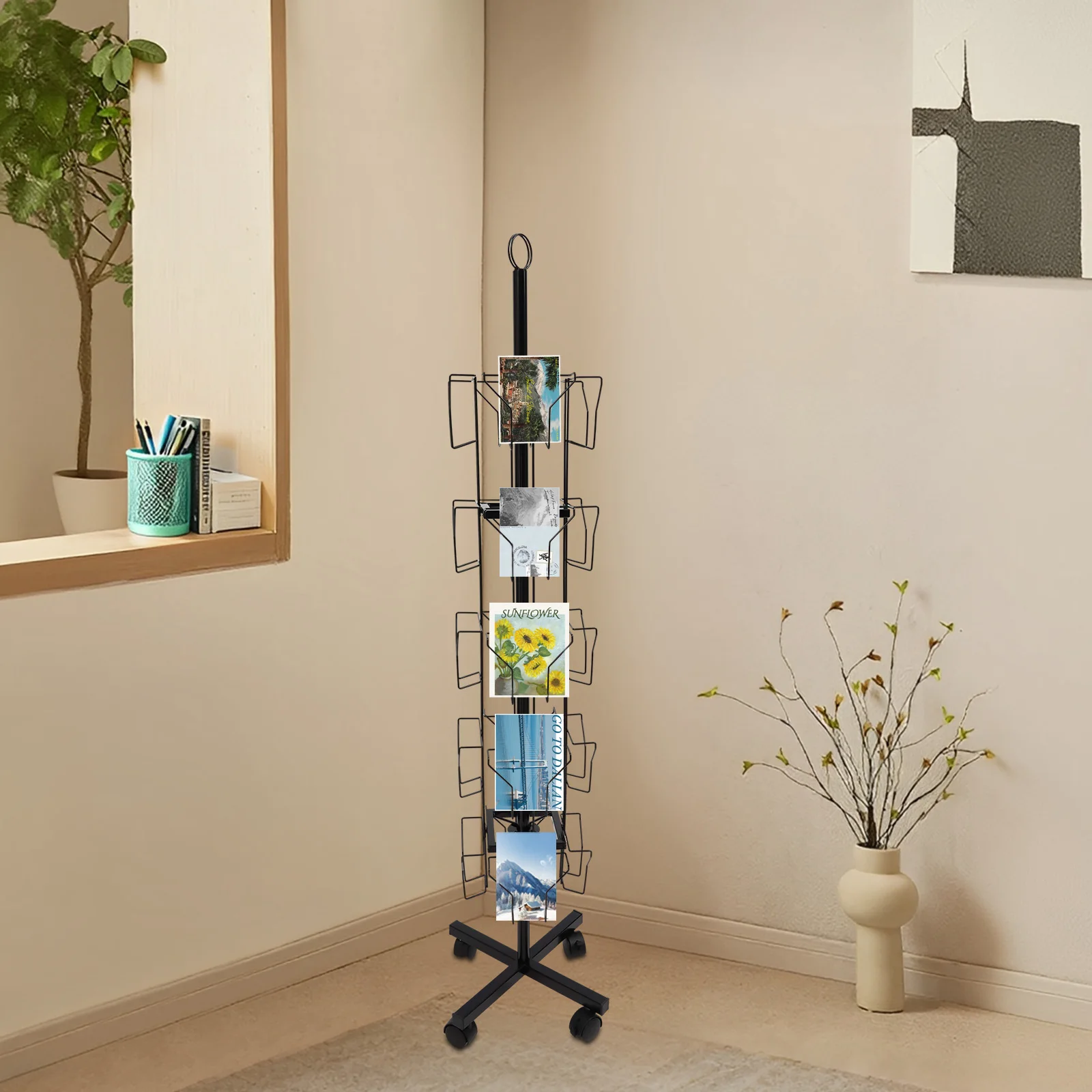 ที่วางการ์ดอวยพรแบบหมุนได้ 5 ชั้น ทำจากเหล็กแผ่นรีดเย็นสีดำ ขนาด 1.52 เมตร พร้อมที่วางแสดงสินค้าแบบเคลื่อนที่ 20 ช่อง พร้อมล้อล็อค