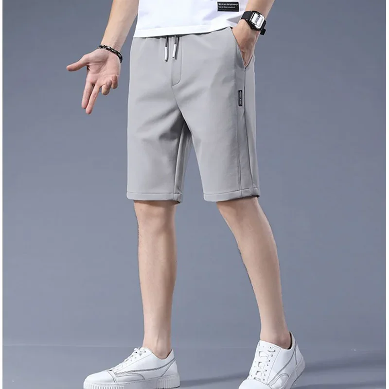 High Quality Polyester Ice Silk Shorts Men 2024 New Korean Version Of Loose Elastic Splicing Beach Five Minute Medium Pants