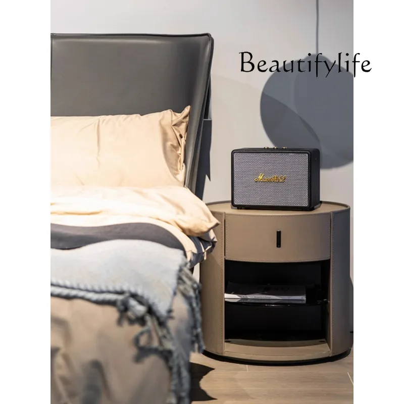 

Italian minimalist saddle leather round bedside table high-end storage creative small apartment storage side cabinet