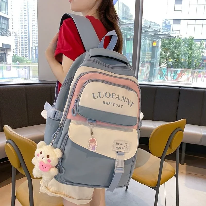 junior high school students schoolbag Female Korean version campus omnibus load reduction backpack big capacity laptop bagpack