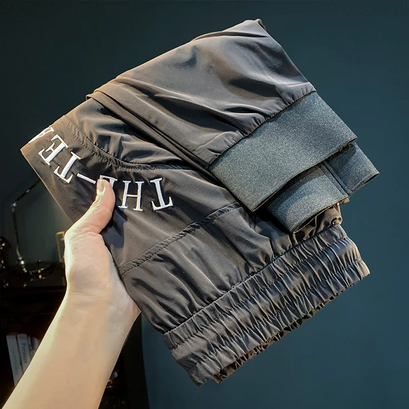 Ultra thin ice silk quick drying casual pants for men in the summer of 2025, new leg binding elastic waistband sports pants