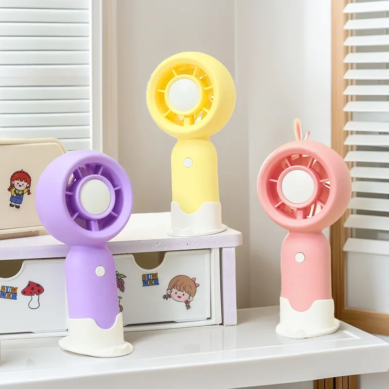 

3-stage small fresh candy color student handheld mini electric fan with base mobile phone stand office fan