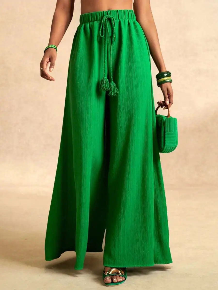 

Женские широкие брюки-палаццо с завязками на талии и декоративными кисточками, изумрудно-зеленые