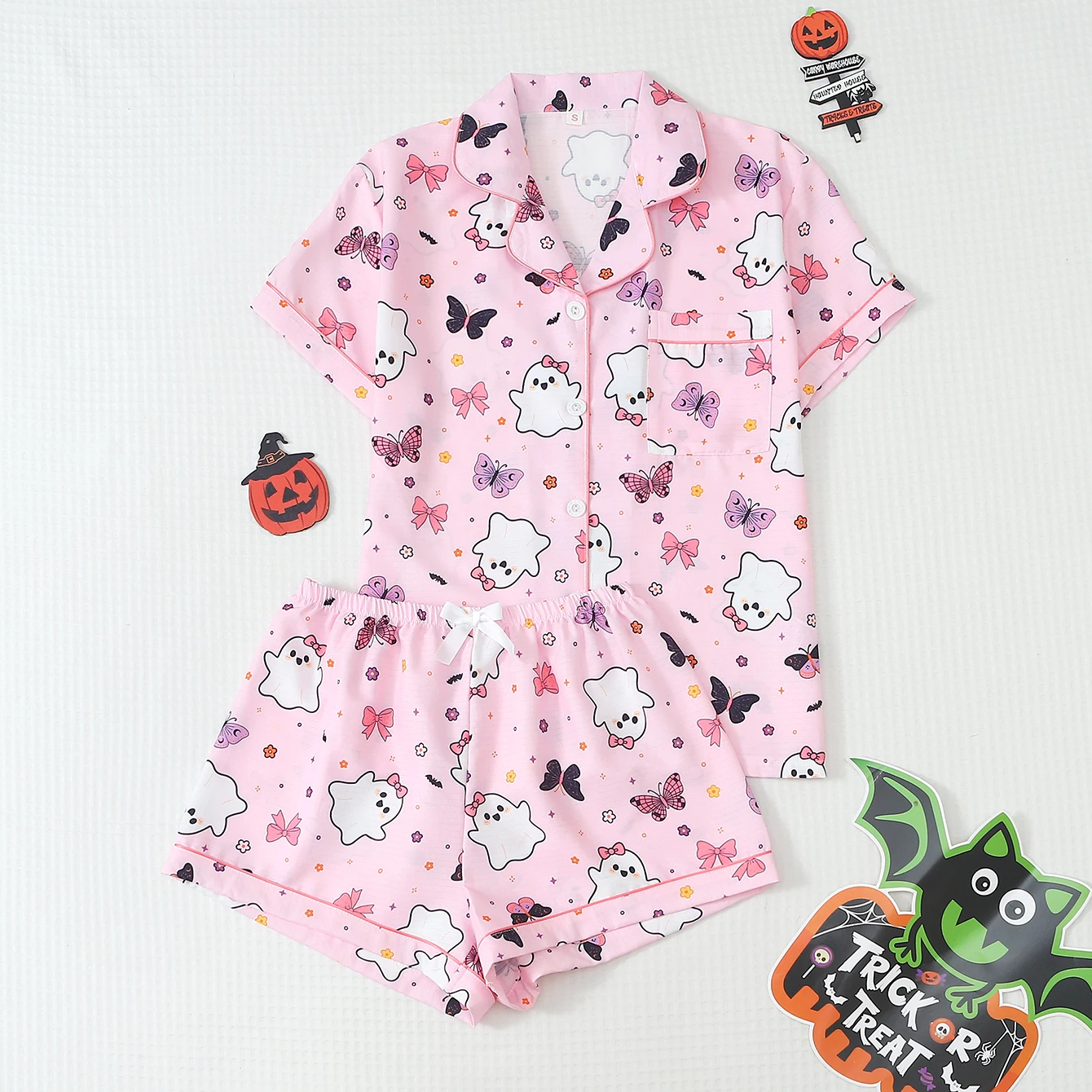2-piece set of quirky and fun Halloween-themed pajamas with ghost, flower, and bow prints, featuring a short-sleeved, hemmed, collared top and bow shorts, suitable for women as home wear and for Halloween