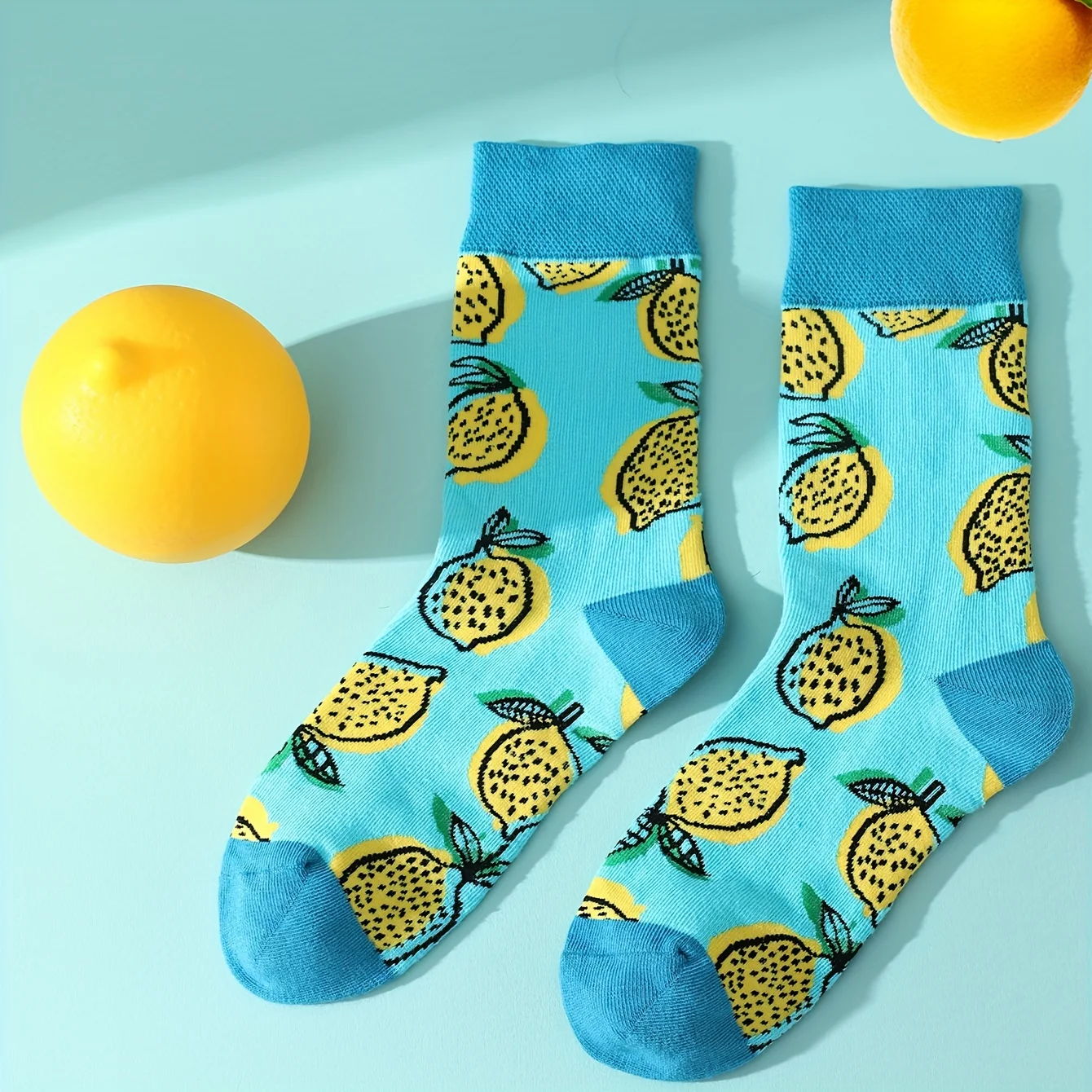 A pair of yellow Gacha box lemon pattern tide socks suitable for Christmas Valentine\'s Day gifts on Halloween