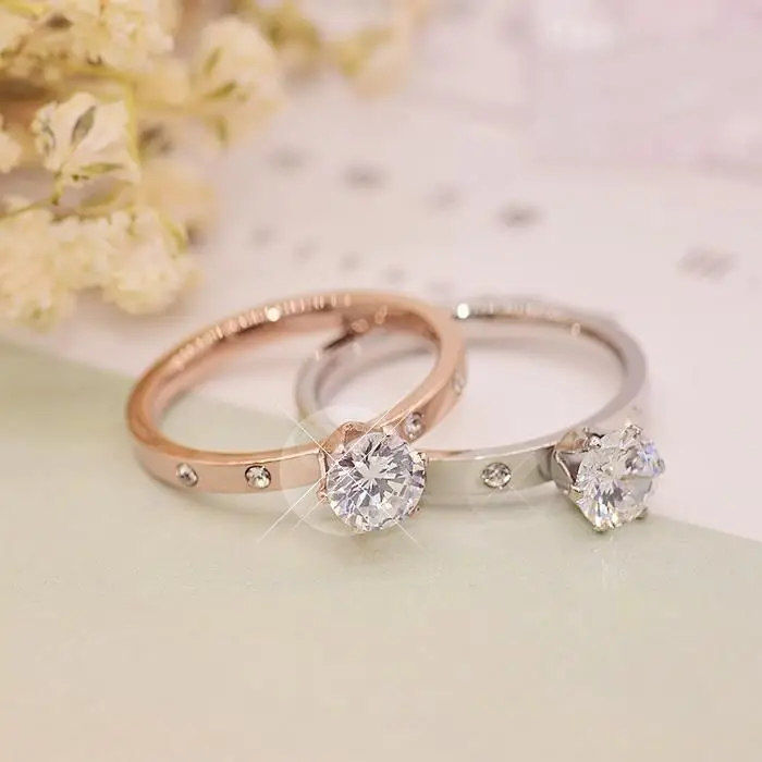 Korean version temperament 18K titanium steel one carat single diamond zircon six claw ring female simple light luxury