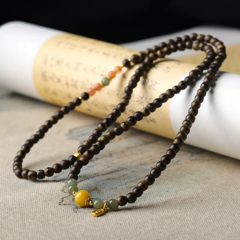 Original design multi-strand bracelet featuring butter-colored agarwood natural beeswax South Red Agate and Hetian jade