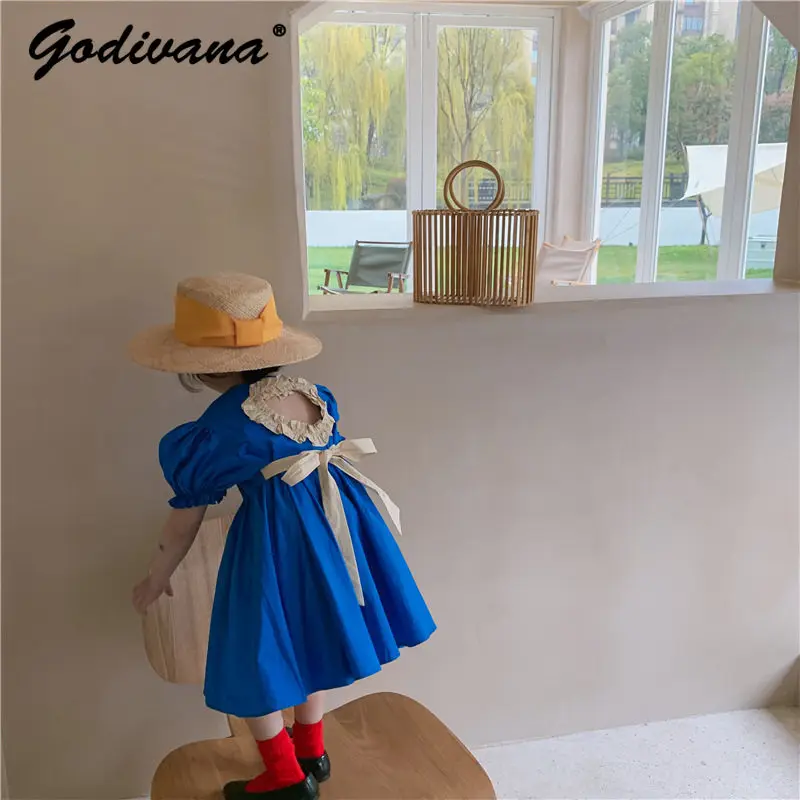 

2026 New Summer Korean Baby Girls Princess Dress Kids Cute Back Cutout Blue Puff Sleeve High Waist Soft Cotton Dress with Tie