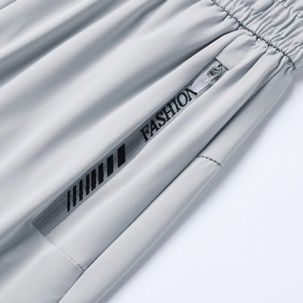 

Slimming Ice Silk Sports Pants Zip Pocket Tapered Running Pants Loose Long Fitness Pants Running