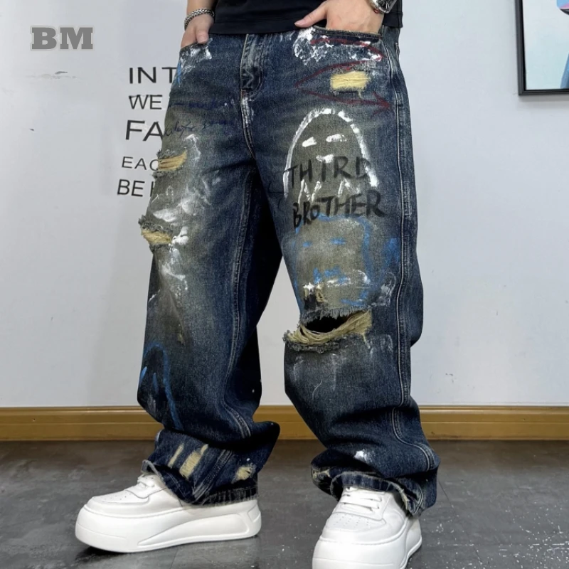 

Korean Streetwear Baggy Jeans Men Hand Drawn Graffiti Washed Ripped Denim Straight Leg Pants Hip Hop Skateboard High Quality