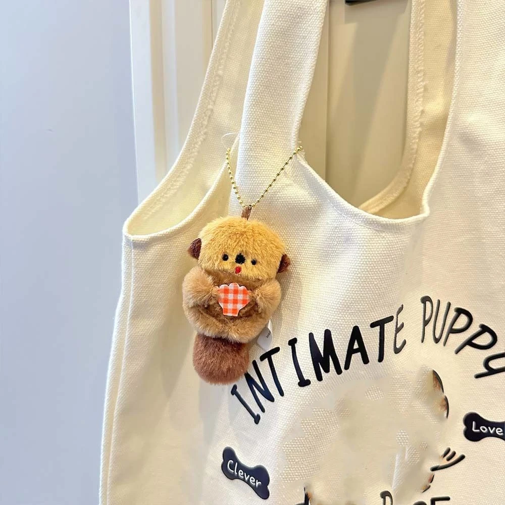 Personnalité poupée loutre tenir coquille porte-clés bibelot Style coréen sac à dos breloques en peluche dessin animé Anime porte-clés porte-clés ornements