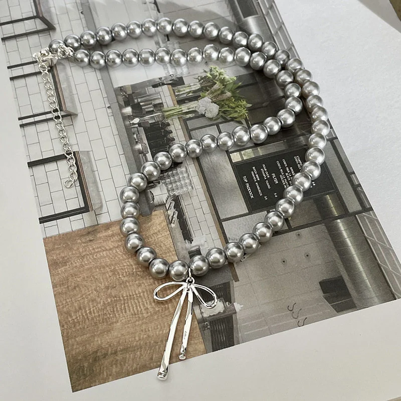 Collar de gargantilla con colgante de lazo de perlas chapado en plata para mujer, joyería llamativa, regalo e2060