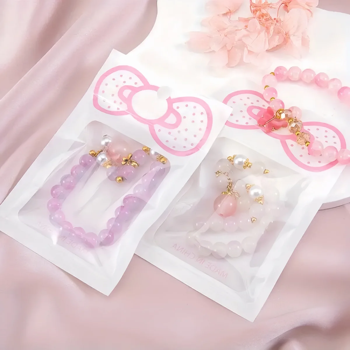 50 Stück/Lot Rosa Transparente Mylar-Ziplock-Beutel mit Schleife Wiederverschließbare Ornament-Aufbewahrungsbeutel für Süßigkeiten, Kekse, Geschenke und Verpackungen – Detail 8