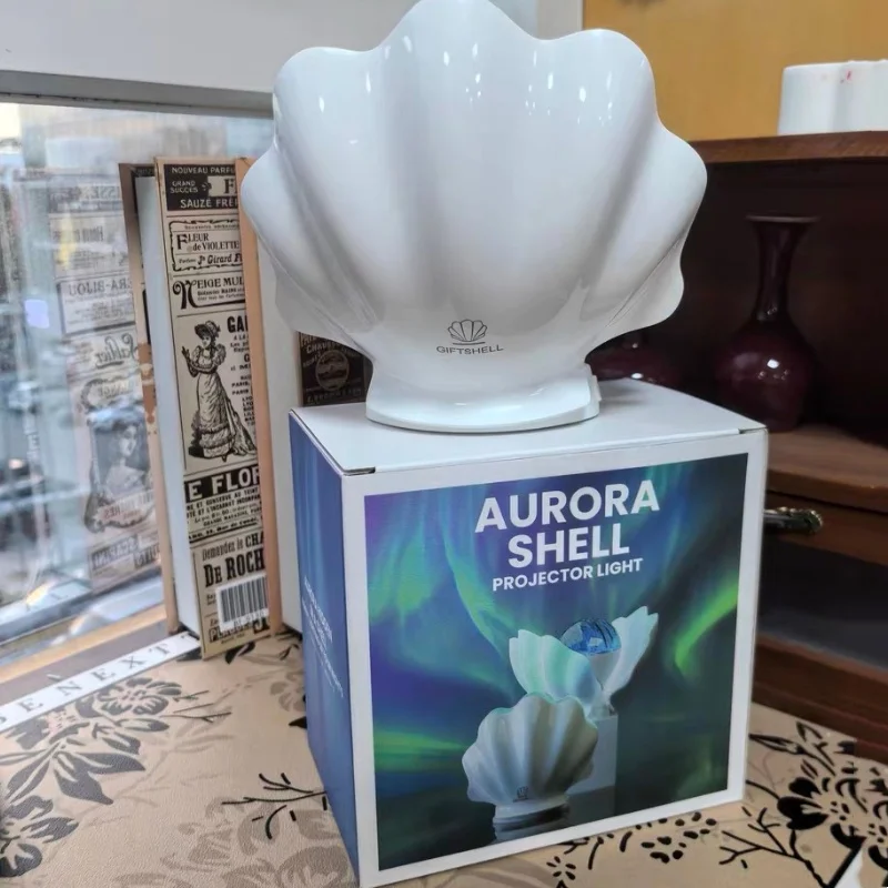

Красочная проекционная лампа в виде ракушки для атмосферы, спальни девушки, Авроры, мечтательное небо, звездного неба, усовершенствованная атмосферная лампа