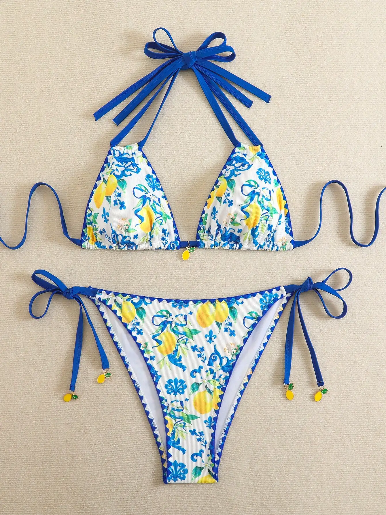 

Blue Tie-Up Lemon Floral Print Bikini Set With Frilled Edges And Charm Details For Summer Beach